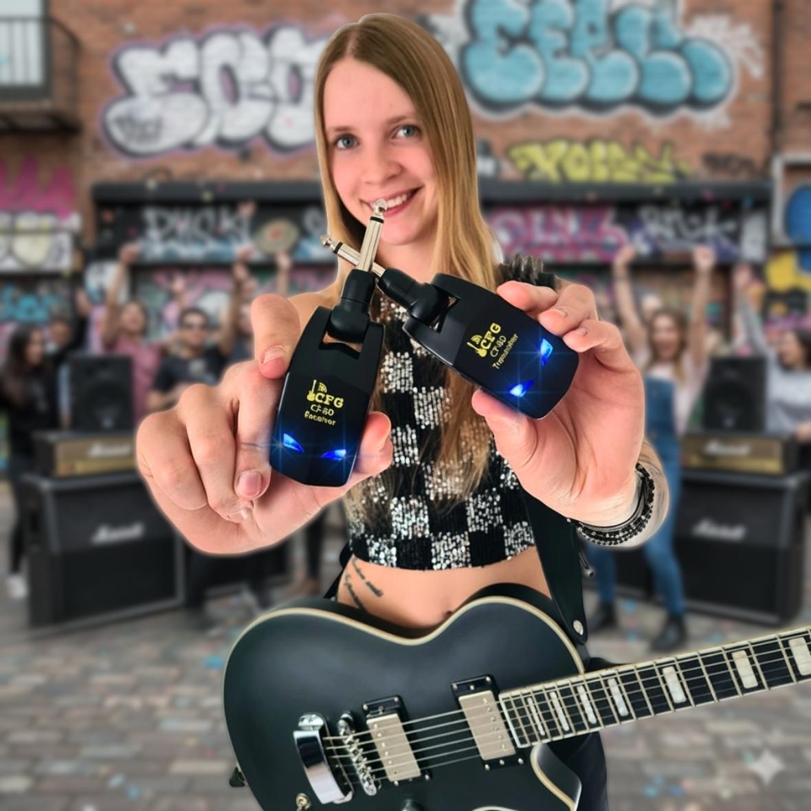 Person holding two guitar tuners with a blurred background of people and music equipment. CF-80 2.4ghz wireless guitar and bass system by CFG cable free guitar
