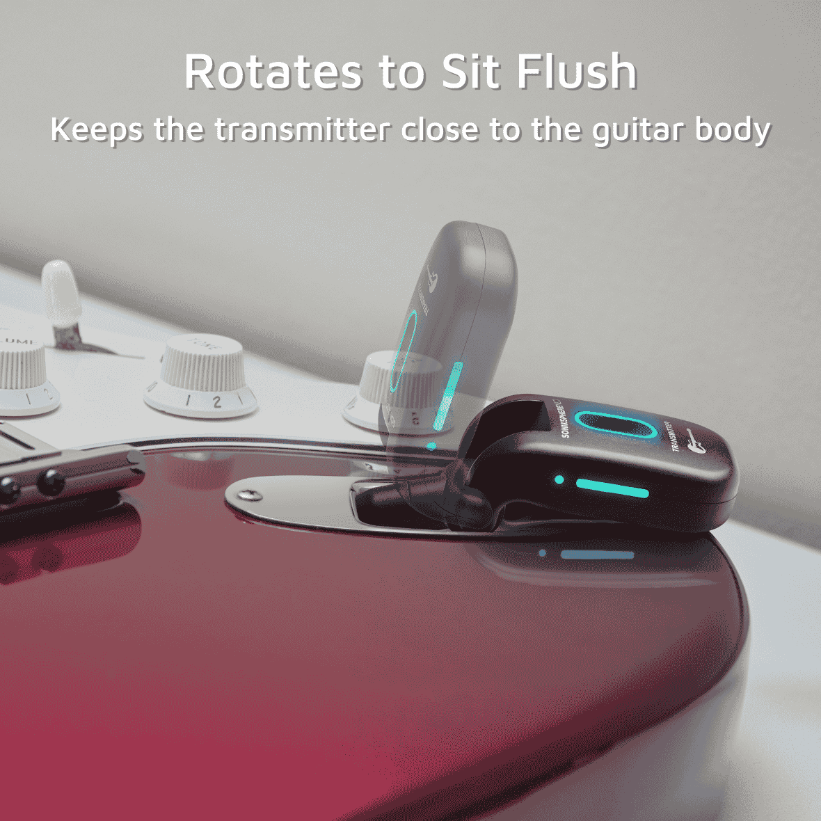 CFG Cable Free Guitar SonikSphere NEO 5.8GHz wireless transmitter plugged into a red electric guitar, demonstrating the 270° swivel plug folding flat against the guitar body for a low-profile, flush fit