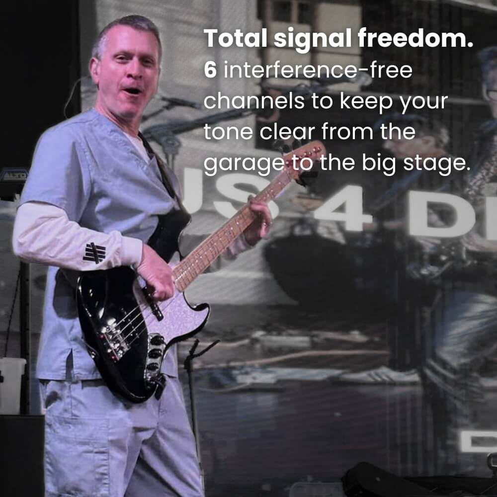 Person playing a bass guitar with promotional text about signal freedom and interference-free channels. CFG Cable Free Guitar SonikSphere wireless guitar bass cordless system no cable uhf 5.8ghz 2.4ghz nexus cf-80