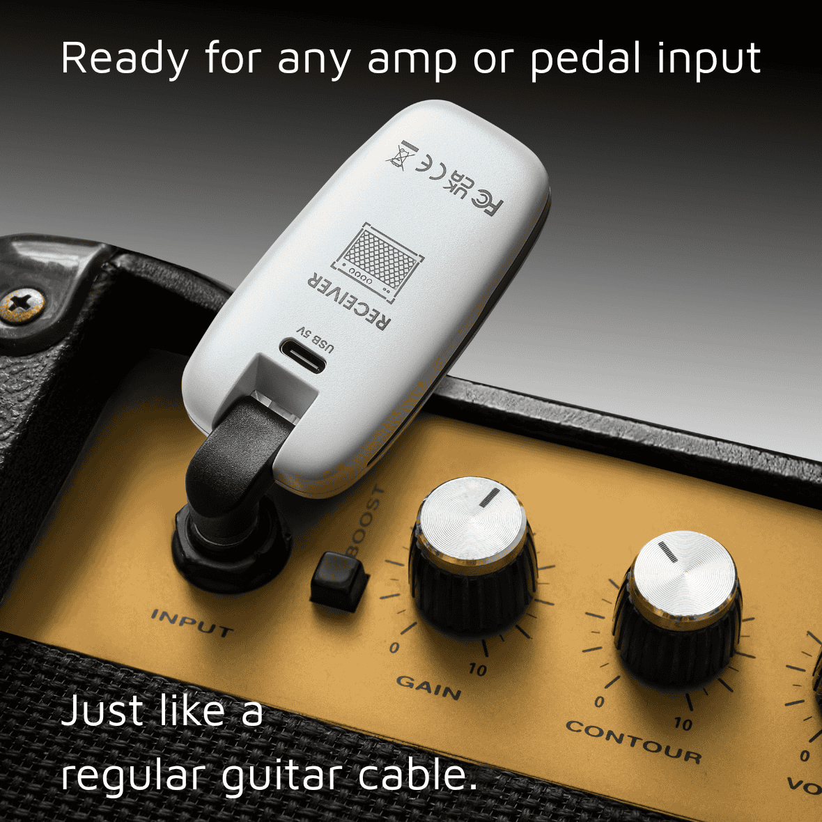 Guitar amplifier with a white receiver attached, labeled 'Receiver'. CFG Cable Free Guitar UHF Nexus wireless guitar and bass system professional cable-free performance 7 seven channels no interference color coded black and white receiver transmitter freedom stage music musician cordless dongle
