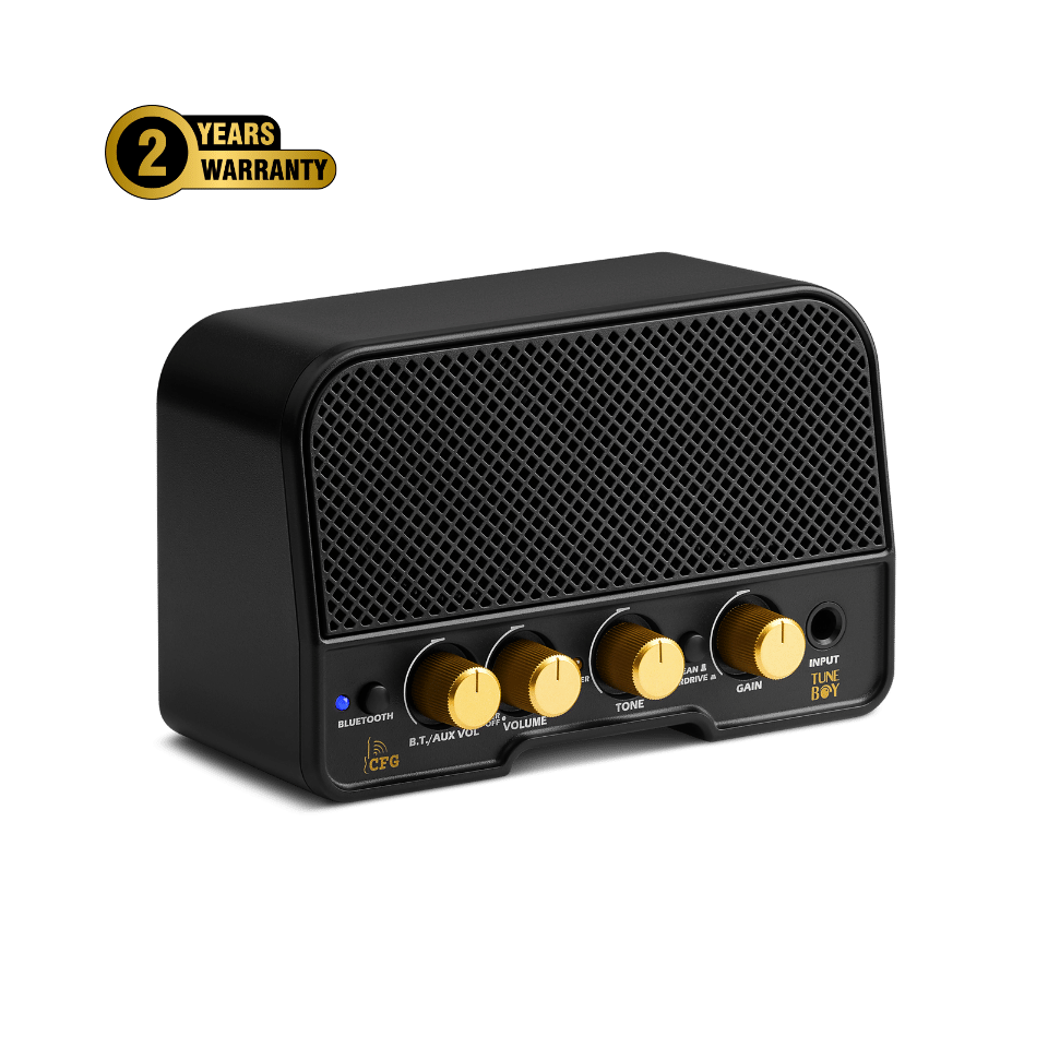 This is an image of a CFG Cable Free Guitar amplifier named TuneBoy. It's a compact, black guitar amp with a mesh front and four golden control knobs for Bluetooth, Drive, Volume, and Tone. There's also an Input Line, and the amp features a '2 Years Warranty' badge on the top left corner against a green background.