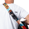 Man wearing a guitar which has the CFG Air Pocket transmitter holster holder and extension cable attached to the strap