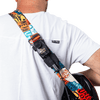 Load image into Gallery viewer, Man wearing a guitar which has the CFG Air Pocket transmitter holster holder and extension cable attached to the strap